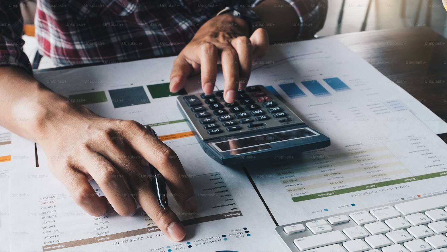 Two people reviewing a cosigner loan agreement together at a table