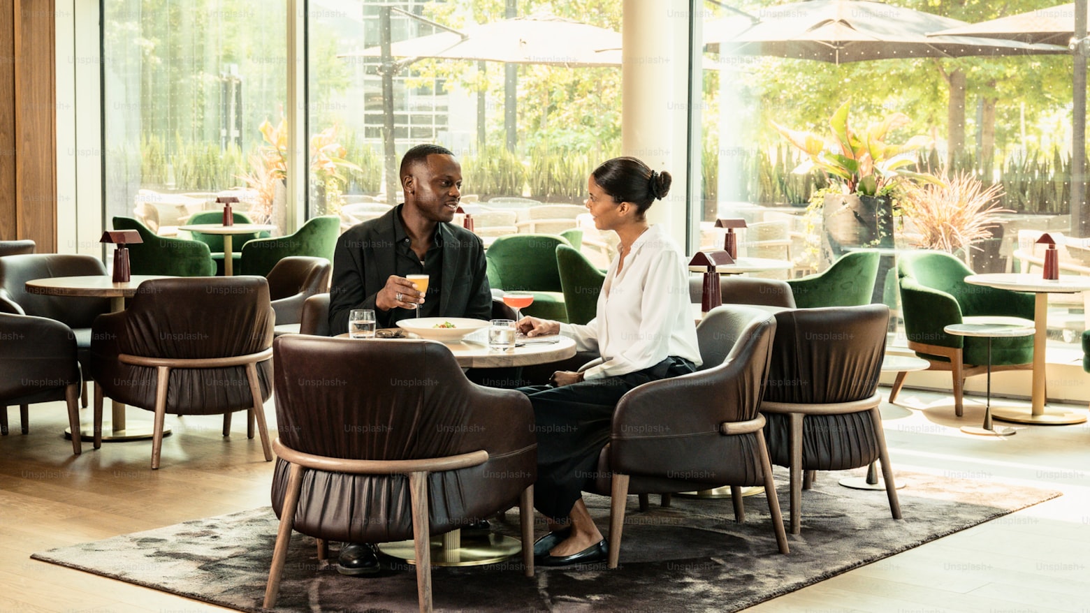 A loan officer explaining loan terms clearly to a borrower across a desk